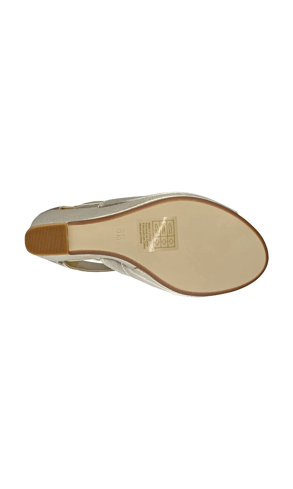 A top-down view of the Rory Champagne Shimmer Prom Shoes by Touch Ups 4477, a beige women's flat with a small heel and care instructions printed on the sole.